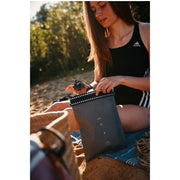 Fidlock Hermetic Dry Bag Mega in use on the beach